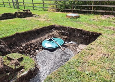 A sewage treatment plant in the ground, being soiled over mid way through an installation project