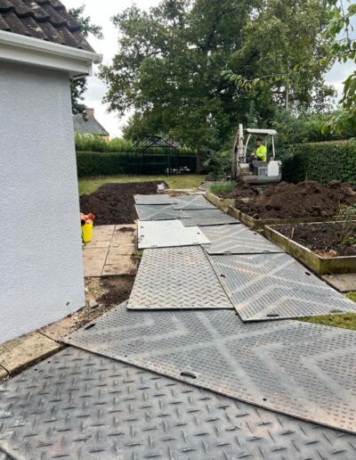 Heavy duty protection matting laid on a garden to protect the lawn and flower beds