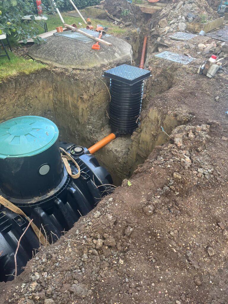 A domestic 7-person Graf package sewage treatment plant in the ground during installation