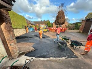 Retarmacking a customer's driveway during the installation of a sewage treatment plant underneath it