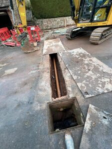 Pipe connections for a sewage treatment plant under a driveway during its installation