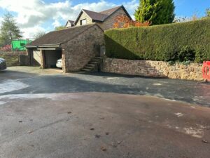 A photo of driveway that has been recently tarmacked
