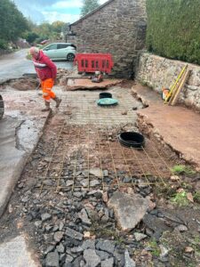 An excavated driveway during the installation of a sewage treatment plant